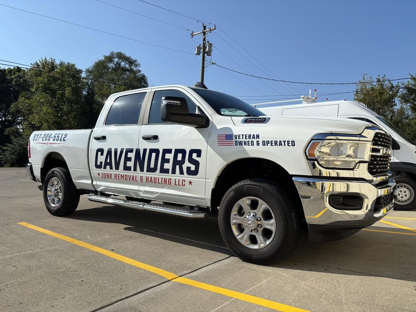 Cavenders Junk Removal Ram 2500 with cut vinyl lettering