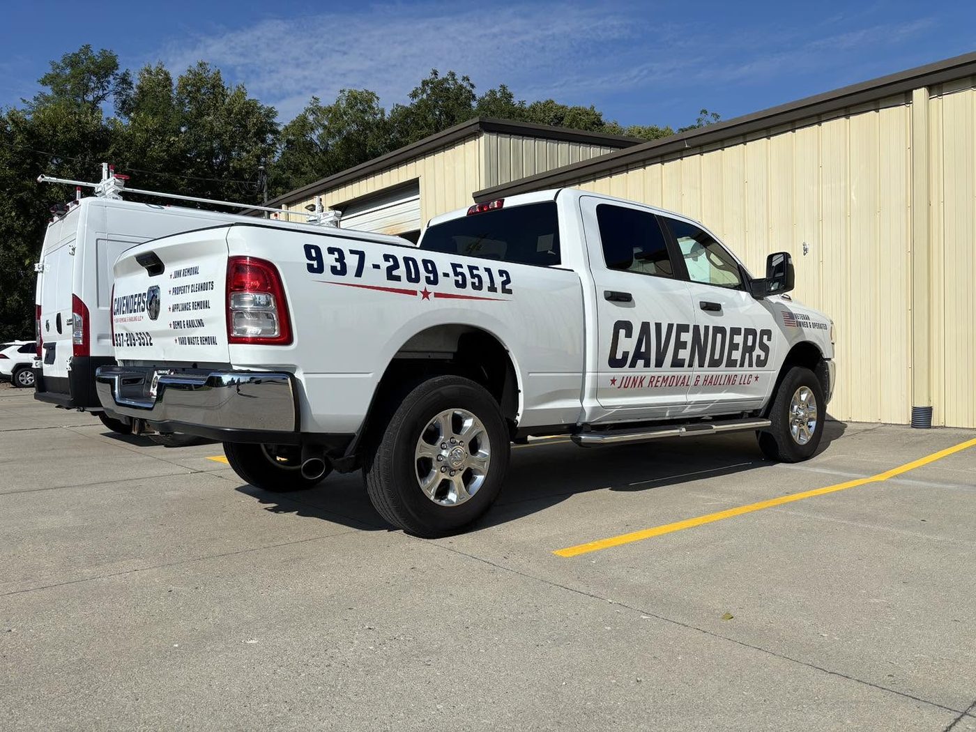 Rear quarter of the Cavenders truck showing the service list and phone number