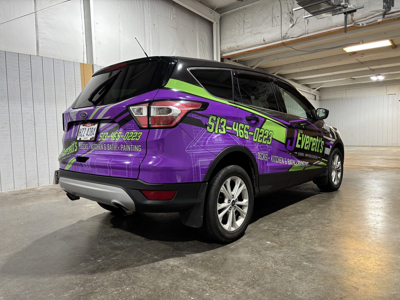 J. Everett's Home Improvement Ford Escape in a purple and green full wrap