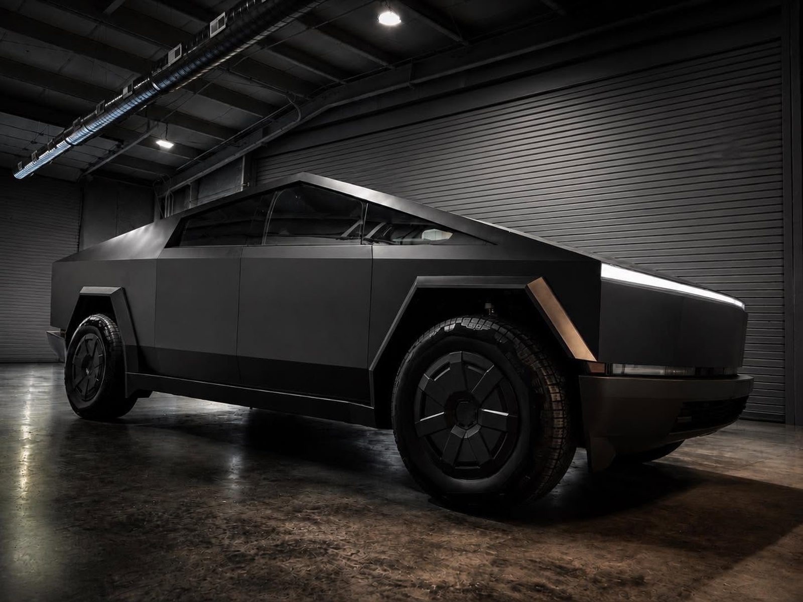 Tesla Cybertruck finished in a satin black color change wrap
